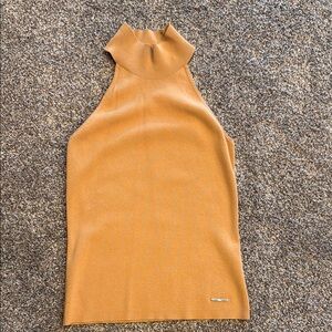 Tan sleeveless blouse
